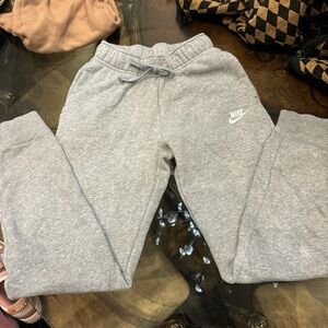Woman’s grey Nike sweats